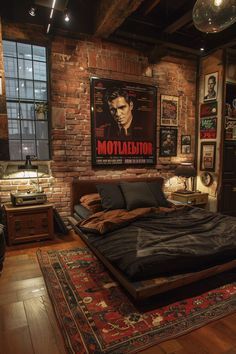 a bedroom with exposed brick walls and wooden flooring is pictured in this image, there are posters on the wall above the bed