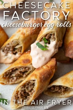 cheesecake factory cheeseburger rolls on a white plate with text overlay that says cheesecake factory cheeseburger rolls in the air fryer