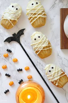 halloween treats are arranged on a marble table