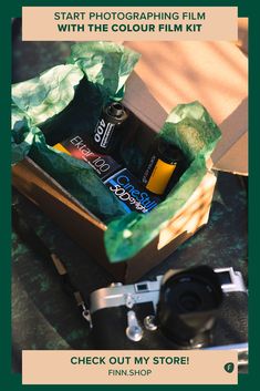 a camera and some bottles in a box on a table with the words start photographing film with the color film kit check out my store