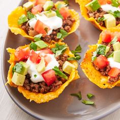 some taco cups are sitting on a plate