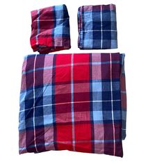 red and blue plaid bedding set with matching pillowcases on white back ground