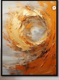 an orange and white abstract painting on a wall