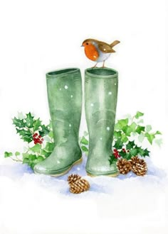 a watercolor painting of a pair of green boots with holly, pine cones and a robin perched on top