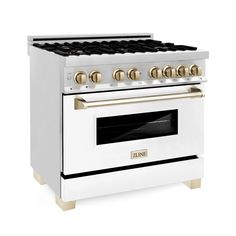 a white stove with gold knobs on the top and bottom burners, in front of a white background