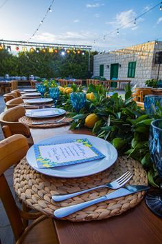 the table is set with place settings for dinner