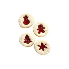 three cookies with jam on them are arranged in the shape of christmas trees and snowflakes