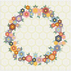 a circular pattern with flowers on it, and the center is made up of hexagonal