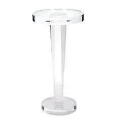 a clear glass table with an acrylic base on the bottom and round legs