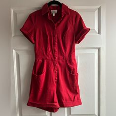 Red Button Down Short Sleeve Romper Fitted Collared Jumpsuits And Rompers With Buttons, Fitted Jumpsuits And Rompers With Button Cuffs, Red Jumpsuits And Rompers With Pockets, Fitted Cotton Jumpsuits And Rompers With Buttons, Collared Cotton Jumpsuit With Buttons, Cotton Collared Jumpsuit With Buttons, Red Retro Jumpsuits And Rompers For Summer, Red Short Sleeve Jumpsuits And Rompers With Pockets, Cotton Button-up Jumpsuits And Rompers