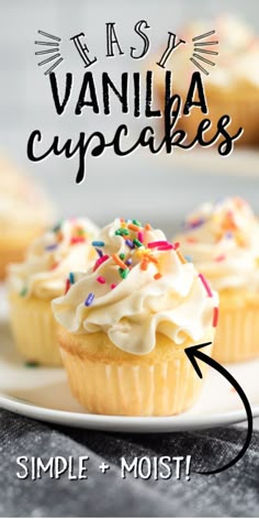 vanilla cupcakes with white frosting and sprinkles on a plate