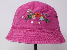 Item: flower embroidered bucket hat Material: 100% cotton Size: one size fits most Embroidery: hand made with acrylic thread Free first class shipping, upgradable priority mail service. 30 days return policy, feel confident at your purchase! Spring Beach Hats 5-panel, Summer Hats With Embroidered Logo, 5-panel Beach Hats For Spring, Spring Beach 5-panel Hat, Cotton Bucket Hat With Curved Brim For Festivals, Adjustable Cotton Hats For Spring, Adjustable Cotton Spring Hats, Cotton 5-panel Hat For Spring, Adjustable Pink Bucket Hat For Festival