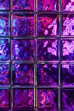 purple and blue glass blocks are shown in this image with the light reflecting on them