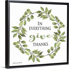 a framed print with the words in everything give thanks on it, surrounded by green leaves