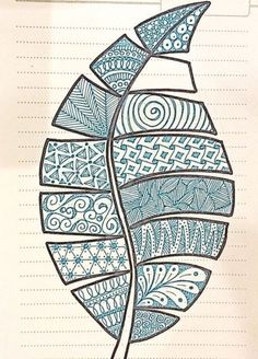 a drawing of a leaf with blue and white designs on it