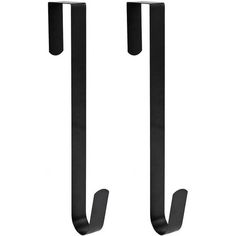 two black metal hooks on a white wall