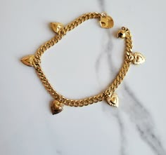 18K gold Plated 5 cute  Dangling heart Charm chain bracelet  20cm in length Hypoallergenic and waterproof  18K gold stamped  Heart has dedicated design graving Lovely chain  Tarnish free Mexican Gold Bracelets, Colombia Outfits, Moana Necklace, Fit Accessories, Vanilla Girl Aesthetic, 3 October, Necklace Aesthetic, Clothing Finds, Jewelry To Buy