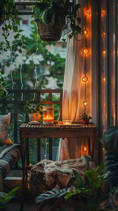 a balcony with plants and candles on the table in front of it, next to a window