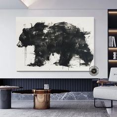 a black and white bear painting in a living room