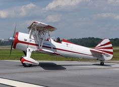 a small airplane is sitting on the runway