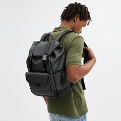 Made for a life in constant motion the League keeps your game plan on track. Crafted of our Signature canvas and refined leather this roomy backpack is a comfortable choice for every day with its padded back and straps. Organized with multiple pockets inside and out the sporty style has a dedicated laptop sleeve and plenty of space for notebooks water bottles and other essentials. An exterior zipper gives easy access to the main compartment. | Coach League Flap Backpack In Signature Canvas - Cha Luxury Coated Canvas Backpack With Large Capacity, Luxury Large Capacity Coated Canvas Backpack, Designer Leather Backpack With Large Capacity, Luxury Coated Canvas Backpack For Everyday, Luxury Coated Canvas Leather Backpack, Coated Canvas Backpack With Large Capacity, Modern Backpack With Adjustable Strap In Coated Canvas, Luxury Coated Canvas Backpack For Travel, Luxury Leather Coated Canvas Backpack For Travel