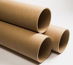 two rolled up brown paper tubes sitting next to each other