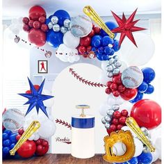 a baseball themed balloon arch with balloons and confetti