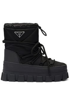 black recycled polyamide calf leather padded design enamel triangle logo round toe front lace-up fastening chunky rubber sole Trip Clothes, Apres Ski Boots, Black Snow Boots, Prada Collection, Prada Nylon, Ski Boots, Triangle Logo, Ski Trip, Prada Men