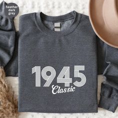 80th Birthday Shirt, 1945 Classic Birthday Sweatshirt, Vintage 1945 Shirt, 80th Birthday Shirt, 80 Birthday Personalized Gift Shirt All the members of the family can use this customized gift, it will be the best wanderlust, travel apparel unisex personalized shirt ever!  Product Details: Premium quality super soft shirts. The T-shirts, Sweatshirts, Hoodies, Youth-Toddler Shirts, and Long Sleeves are unisex.  Reading the Sizing Chart: Please note that the sizing chart includes the measurements of one side of the shirt, not the circumference. Please review all the sizing charts that were added to the product pictures. How Do I Order 1- Please review all the information provided before placing an order 2- Select the shirt type and size using the drop-down menu. 3-  Select the color of the shi Classic Birthday, Travel Apparel, Members Of The Family, Birthday Sweatshirt, Birthday Personalized, Personalized Birthday Gifts, Sweatshirt Vintage, 80th Birthday, From Santa