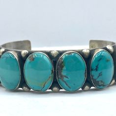 Navajo Kingman Turquoise Bracelet With Six Oval Cabochon Surrounded By Bead Drop Border. Turquoise Is Stunning Lighter Blue Color Of Excellent Quality. Period: After 1950 Origin: Navajo, Southwest Size: 7", 1 3/4" Opening, 1 1/4"H, 2.75" X 2" Signed By Pj Acsit Kingman Mine, Turquoise, Sterling Silver, Bracelets, Navajo (1 Inch = 25.4 Mm; 1 Dime = 17.9mm). All Items Are Pre-Owned Unless Otherwise Stated. This Means They Have The Usual Aspects Of Pre-Owned Jewelry, Such As Light Scratches, Wear And Tarnish. Please Review All The Photos Which Will Be Part Of The Description. Turquoise Cuff, Kingman Turquoise, Mens Accessories Jewelry, Light Blue Color, Cuff Bangles, Oval Cabochon, Blue And Silver, Turquoise Bracelet, Light Blue