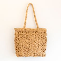 IN STOCK FAST SHIPPING FROM LOS ANGELES Artfully designed for your summertime getaways, the Elena Handbags Floral Design Straw Beach Tote adds a touch of charm and elegance to any beachwear ensemble. Crafted from lightweight straw and woven with intricate floral designs, this bag is the perfect companion for yoga, the market place, and, of course, the beach. Elegant and tasteful, this sophisticated tote is sure to turn heads. Size is approximately 28cm wide x 25cm tall (11in x 10in) Designer Style ID: 8475 Straw Beach Tote with Floral Design, Handmade Straw Woven Shoulder Bag, Summer Beach Bag Sand-colored Straw Bag For Summer Beach, Beachy Sand-colored Straw Bag, Lightweight Rectangular Shoulder Bag For Beach, Lightweight Rectangular Shoulder Beach Bag, Chic Lightweight Straw Beach Bag, Brown Summer Straw Bag For Beach, Summer Brown Straw Beach Bag, Summer Lightweight Crochet Bag In Natural Color, Summer Beach Brown Straw Bag