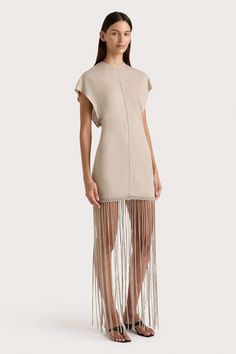 A fitted mini dress, designed from a sheer linen jersey with slight stretch. Featuring a high round neckline and short batwing-style sleeves, it is contoured through the body with a stitch detailing down the front and back. The hem is adorned with handwoven macrame, before falling into an ankle-grazing fringe skirt. Pair with a simple heel or sandal for a unique approach to occasionwear. Maxi Dress Sale, Fitted Mini Dress, Fringe Skirt, Fringe Dress, Faithfull The Brand, New Arrival Dress, Batwing Sleeve, Special Occasion Dresses, Occasion Dresses