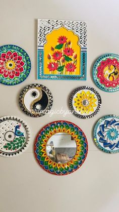 there are many decorative plates on the wall