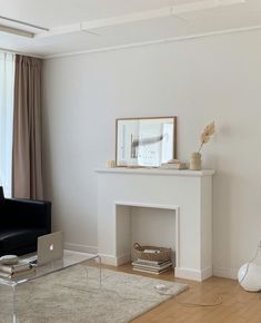 a living room with a couch, chair and fireplace