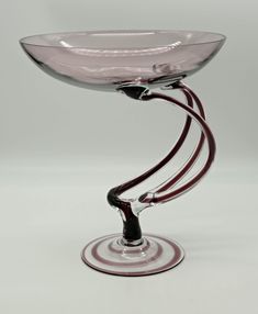 a glass bowl sitting on top of a table