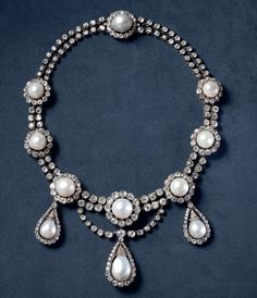 Vintage Inspired Queen  Margrethe II cubic zircon pearl necklace  for women Handmade Metal: Sterling Silver  Metal Purity:925 Metal weight: 75.99 gram Stone: Cubic  Stone Ctw:25.90ctw Gemstone: Pearl Gemstone weight: 12.989 ct Item length:.17 inch Formal Pear-shaped Diamond Pearl Necklace, Pear-shaped Diamond Necklace With Pearl Drop, Pearl Pendant Necklaces With Diamond Accents, Silver Pearl Necklaces With Jewels, Silver Pearl Necklaces With 17 Jewels, Formal Silver Pearl Necklace With Jewels, Silver Jeweled Pearl Necklace For Formal Occasions, Exquisite Diamond Necklaces With Pearl Drop, Exquisite Diamond Necklace With Pearl Drop