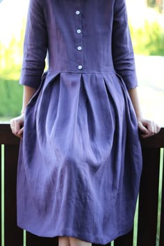 "Beautiful eggplant color women linen dress. Handmade in our studio, a perfect option for autumn and any occasion. Absolutely perfect for breastfeeding. Made from locally manufactured mid weight washed linen fabric. -------------------------------------------------------------------------------------------------------- DESCRIPTION: Loose fitted body, pleated skirt, classic shirt collar, button opening at front side, 3/4 sleeves, hidden pockets at the side seam of the skirt, the length of the dre Dress With Front Buttons, Shirt Collar Dress, Linen Loose Dress, Pleated Skirt Dress, Linen Dress Women, Eggplant Color, Linen Midi Dress, Dress Handmade, Womens Vintage Dresses