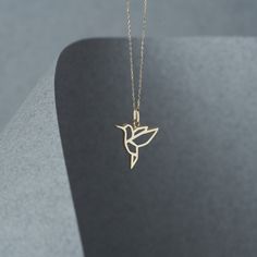 The gold bird pendant hangs delicately on a chain and makes a subtle, yet stylish statement. It's perfect for everyday wear and can be dressed up or down. 14k Solid Gold Minimal Bird Necklace for Women, Yellow White & Rose Gold, Bird Pendant Necklace, Good Luck, Cute Bird Everyday Necklace -- ⋆ This product is designed with Runda's fine handcrafting with sustainable methods. ⋆ Express-insured shipping to the whole world and delivery to cargo in only 3 business days. ⋆ Free return and warranty Pr Unique Gold Pendant Designs For Women, Elegant Gold Jewelry With Bird Design, Gold Necklace With Bird Design As Gift, Gold Bird-shaped Jewelry With Bird Design, Gold Pendant Necklace With Bird Design, Gold Necklace With Bird Design For Gift, Elegant Gold Necklace With Bird Design, Good Luck Cute, Minimal Gold Necklace