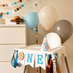 a baby's 1st birthday party with balloons and decorations