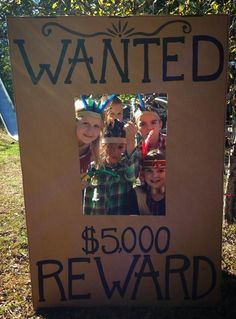 a cardboard sign that says wanted $ 500 reward with pictures of children in the front