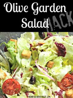 a salad with lettuce, tomatoes and croutons in it is shown