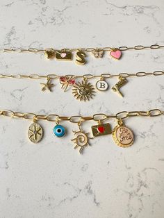 Create a one-of-a-kind piece with our Customizable Charm bracelet! Choose from a variety of colorful charms to build your own unique bracelet that reflects your personality and style. Perfect for birthdays, special occasions, or as a thoughtful gift, this personalized bracelet allows you to mix and match charms, making it a truly special accessory. Celebrate individuality with a custom-made bracelet that's as unique as you are! Custom Bracelet, Personalized Bracelet, Unique Bracelets, Custom Bracelets, Charm Bracelets, Build Your Own, Favorite Jewelry, Thoughtful Gifts, Birthday Gift