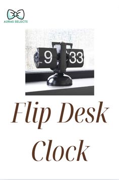 the flip desk clock is sitting on top of a window sill, and reads 9 33