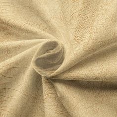 a close up view of a tan fabric with an interesting pattern on it's surface