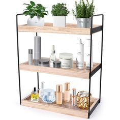 three tiered shelving unit with plants and skin care products