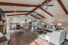 a living room filled with furniture and a fire place