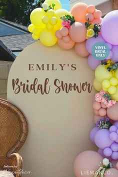 a sign that says,'bridal snow'with balloons and flowers on it