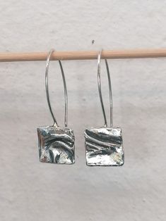 These square irregular dangle earrings are designed for all-day wear. They are eye-catching and handmade from high-quality 925 sterling silver. See my whole jewelry collection here--> https://www.etsy.com/shop/SosyGallery Follow Sosy Gallery on Instagram @sosy_gallery Twitter--> https://twitter.com/sosygallery Facebook--> https://www.facebook.com/sosygallery https://gr.pinterest.com/sosygallery/ Nickel-free Rectangular Sterling Silver Earrings, Nickel-free Silver Square Pendant Earrings, Jewelry Earrings Dangle, Jewelry Collection, Square, Dangle Earrings, 925 Sterling Silver, Jewelry Earrings, Texture