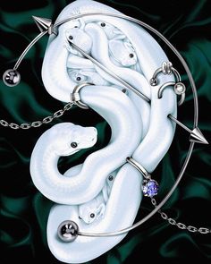 a white snake with some piercings on it's back and an arrow in the middle