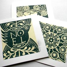 three cards with black and white designs on them